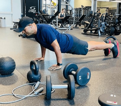 Person doing push-up with equipment