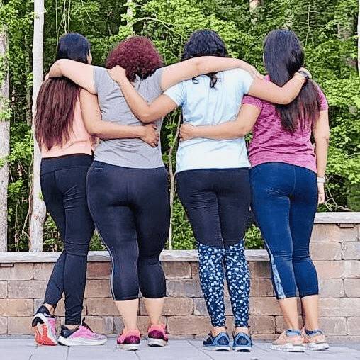 Group of friends with arms around each other